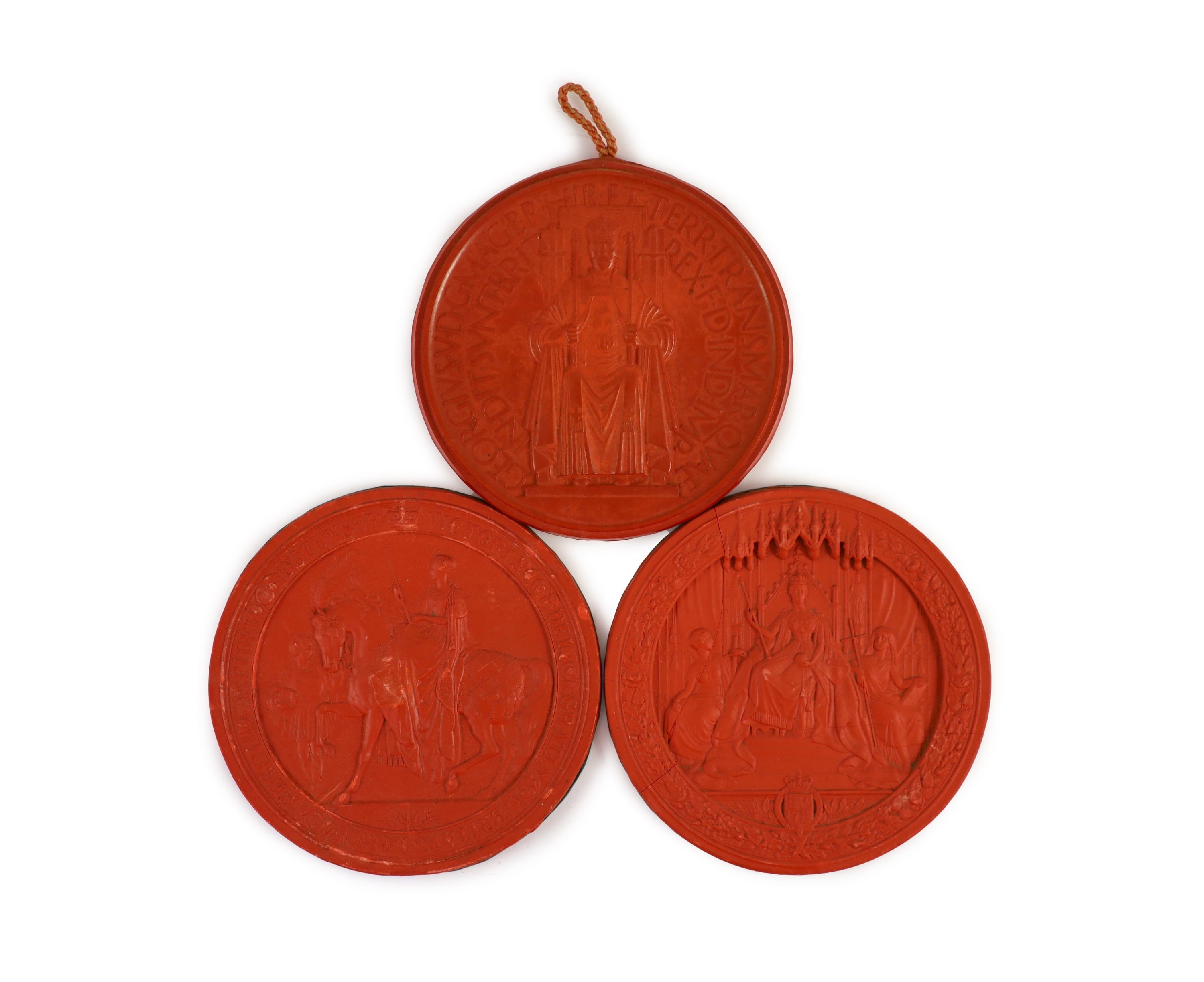 Three red wax Great Seals, two Queen Victorian Great Seals of the Realm, and a George V seal, 16.5 and 16 cm diameter